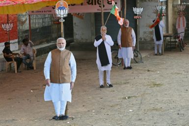 Cut-outs of India's Prime Minister Narendra Modi and his Bharatiya Janata Party candidate Parshottam Rupala at an election campaign venue in Rajkot district in Gujarat