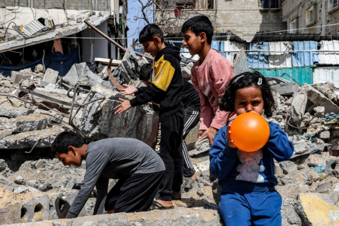Children amid the rubble of a destroyed building in Rafah in the southern Gaza Strip on April 5, 2024.