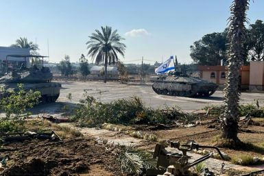 Israeli tanks seized and closed the Palestinian side of the Rafah crossing between Egypt and Gaza on Tuesday halting all fuel deliveries to the besieged territory