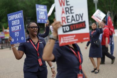 American Airlines flight attendants and their supporters form a picket line outside the White House
