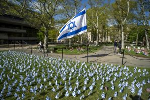 Israeli flags are pictured in front of a pro-Palestinian encampment (out of frame) on the lawn of the Stratton Student Center campus at the Massachusetts Institute of Technology (MIT) in Cambridge, Massachusetts, on May 9, 2024