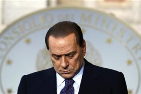 Italy's PM Silvio Berlusconi bows his head during a news conference with Malta's PM Lawrence Gonzi in Rome