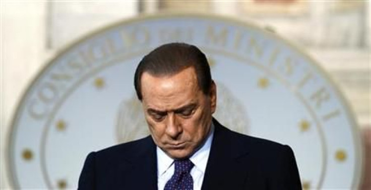 Italy's PM Silvio Berlusconi bows his head during a news conference with Malta's PM Lawrence Gonzi in Rome