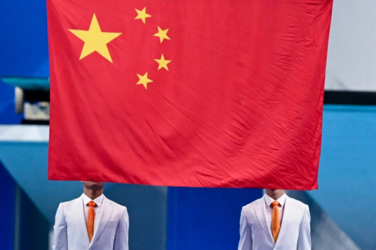 China's flag is raised at the swimming at the Asian Games last year