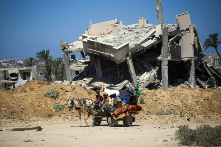 Palestinians on a donkey cart in Khan Yunis in the southern Gaza Strip on July 3, 2024