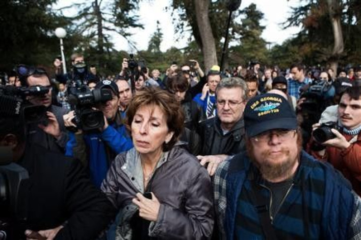UC Davis Chancellor Linda Katehi (C) leaves an &quot;Occupy UCD&quot; rally on campus in Davis, California November 21, 2011. More than 1,000 demonstrators rallied on Monday at the University of California at Davis to protest the pepper-praying of student