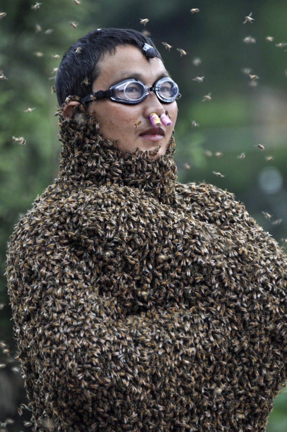 Bizarre Images of Chinese Farmers Covered With Thousands of Killer Bees.