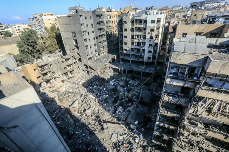 https://d.ibtimes.com/en/full/4550790/homes-are-heavily-damaged-around-buildings-levelled-israeli-strikes-that-targeted-killed.jpg