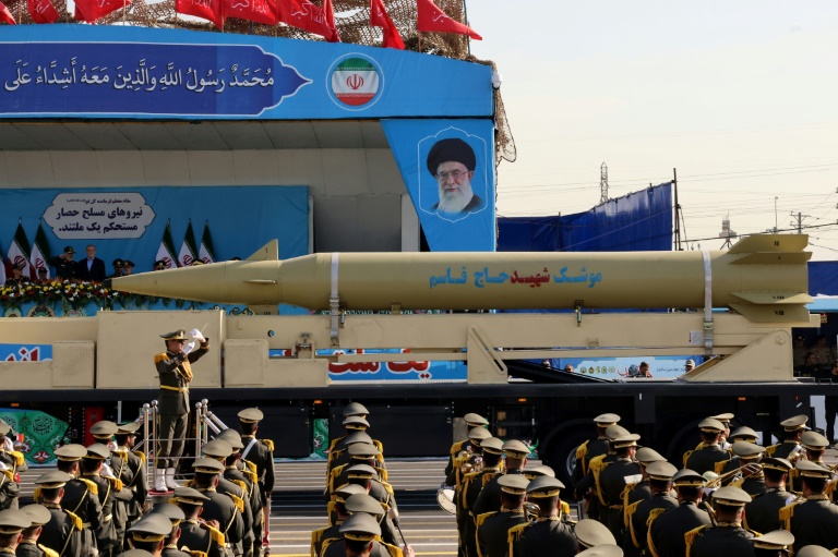 https://d.ibtimes.com/en/full/4551189/irans-president-looks-qasem-soleimani-missile-displayed-during-annual-military-parade.jpg