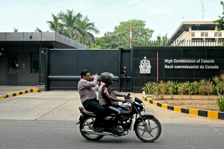 https://d.ibtimes.com/en/full/4554648/motorist-rides-past-entrance-canadian-high-commission-new-delhi-tensions-between-countries.jpg