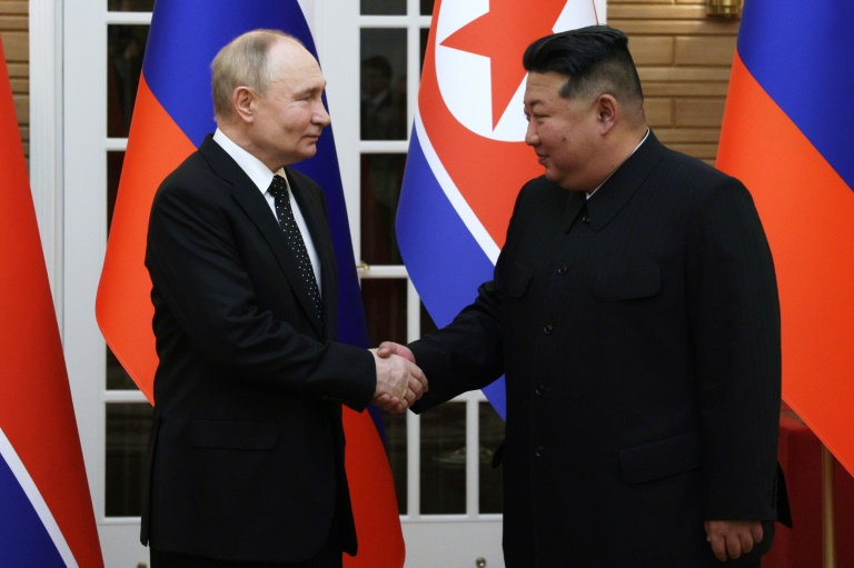 https://d.ibtimes.com/en/full/4556570/russias-president-vladimir-puti-signed-mutual-defence-pact-north-korean-leader-kim-jong-un-june.jpg