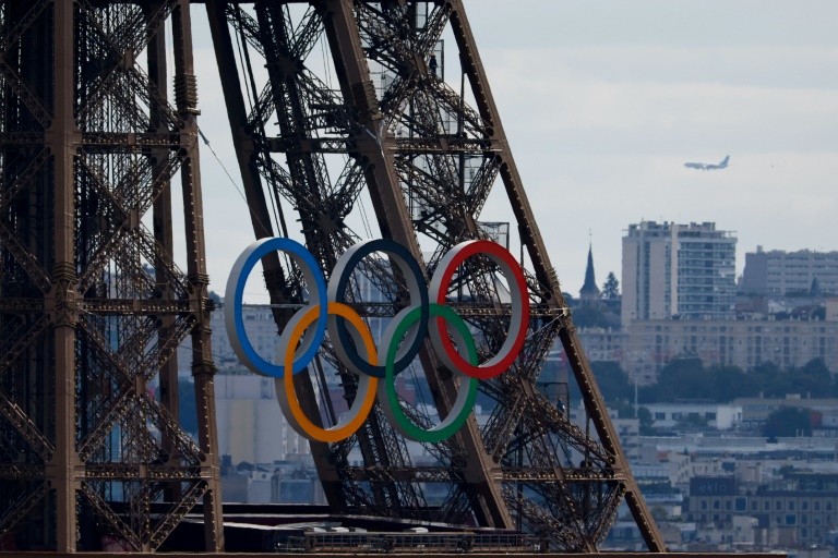 https://d.ibtimes.com/en/full/4560522/olympic-rings-adorned-eiffel-tower-during-paris-games.jpg