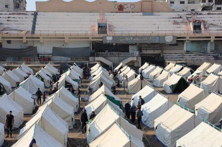 https://d.ibtimes.com/en/full/4560563/palestinians-displaced-ongoing-war-gaza-shelter-tents-palestine-stadium-gaza-city.jpg