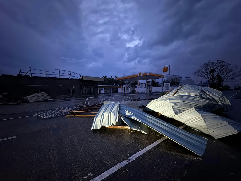 https://d.ibtimes.com/en/full/4560716/roof-corrugated-sheet-litters-highway-cagayan-province-after-typhoon-yinxing-struck-november-7.jpg