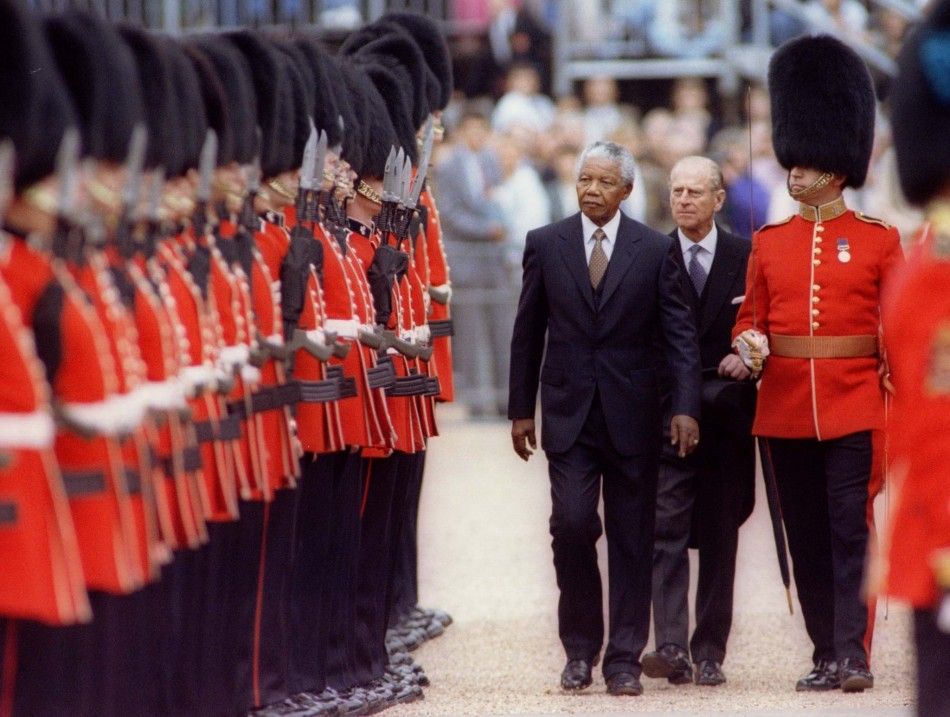 Nelson Mandela and the Duke of Edinburgh review a guard of honour during a visit to Britain