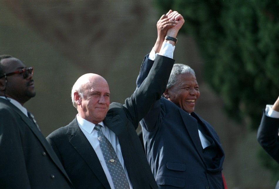 Mandela and President F.W. de Klerk address a crowd in front of the Union Building in Pretoria