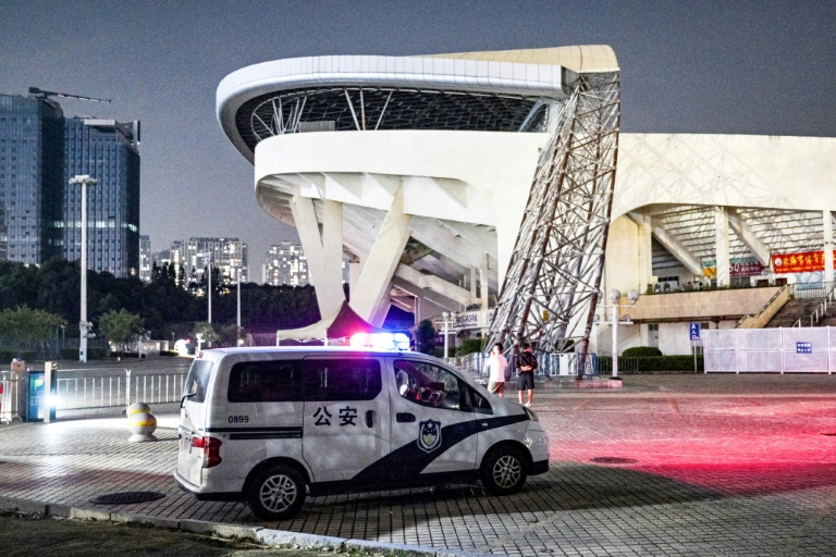 https://d.ibtimes.com/en/full/4561176/police-car-seen-zhuhai-sports-centre-november-12-2024-day-after-car-rammed-through-site.jpg