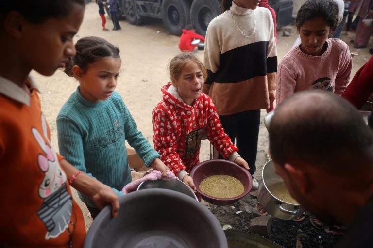 https://d.ibtimes.com/en/full/4562380/palestinian-children-receive-hot-meal-bureij-refugee-camp-central-gaza-november-16-2024.jpg