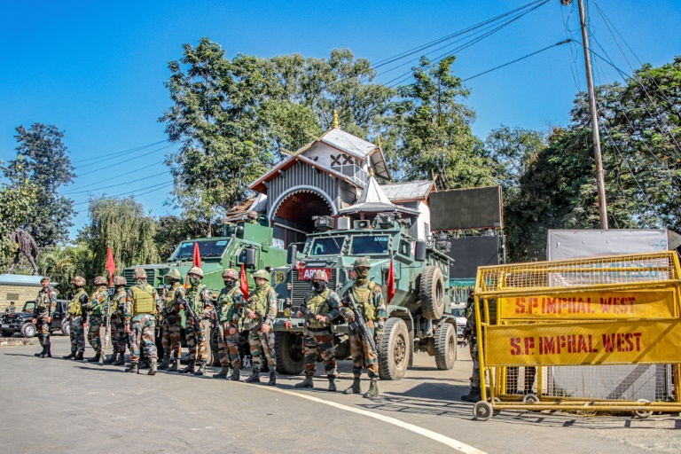 https://d.ibtimes.com/en/full/4562961/army-personnel-stand-guard-tuesday-during-curfew-imphal-indias-northeastern-state-manipur.jpg