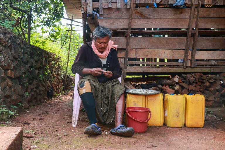 https://d.ibtimes.com/en/full/4563150/farmer-hla-han-52-who-lost-his-leg-after-stepping-mine-sits-outside-his-house-demoso.jpg