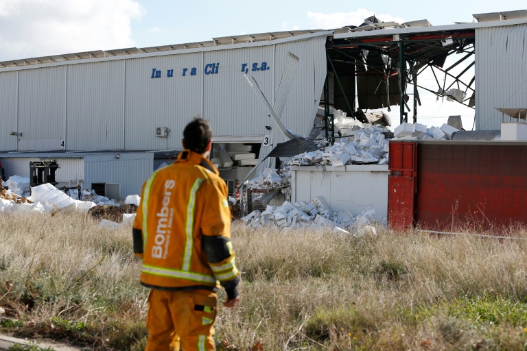 https://d.ibtimes.com/en/full/4565140/firefighter-stands-next-partially-collapsed-factory-after-explosion-killed-three-people-town.jpg