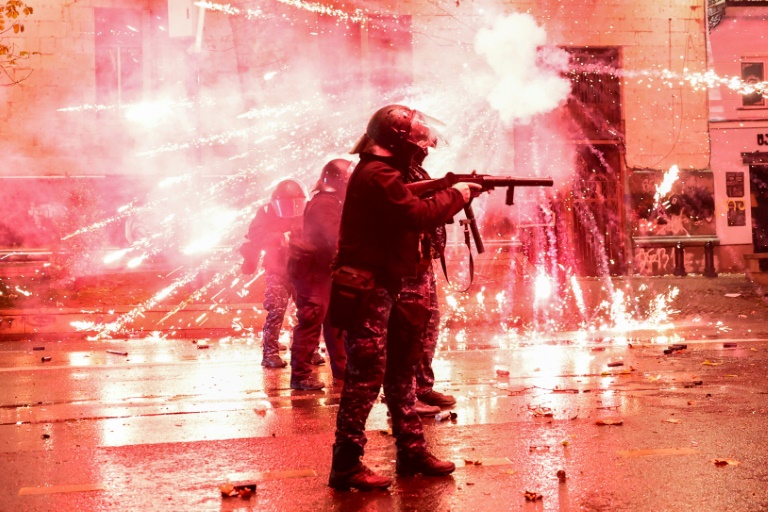 https://d.ibtimes.com/en/full/4565989/fireworks-shot-protesters-exploding-near-police-tbilisi-early-december-2-2024.jpg