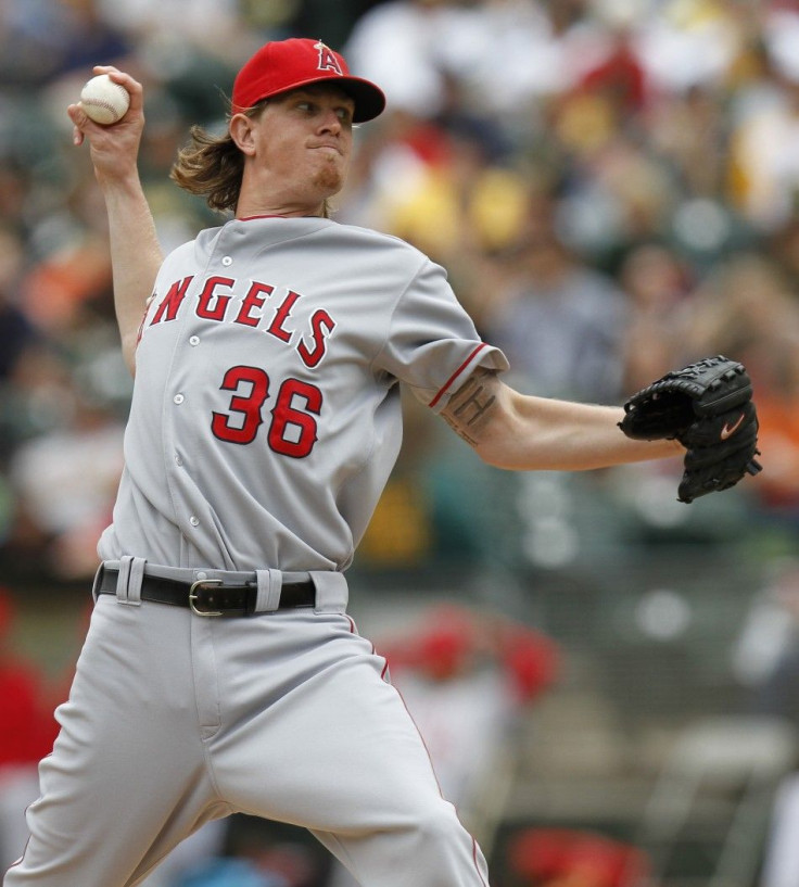 Los Angeles Angels starting pitcher Jered Weaver throws in the first inning against the Oakland Athletics during the first game of their MLB American League baseball game doubleheader in Oakland, California