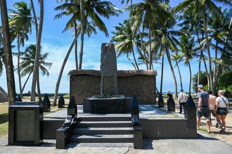 https://d.ibtimes.com/en/full/4571497/tourists-visit-memorial-monument-commemorate-victims-2004-tsunami-peraliya-december-25-2024.jpg