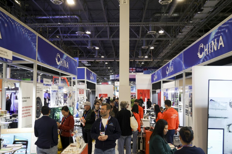 https://d.ibtimes.com/en/full/4574014/attendees-walk-past-row-chinese-businesses-annual-las-vegas-tech-show-ces-january-2024.jpg