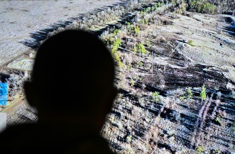 https://d.ibtimes.com/en/full/4575836/officer-ukrainian-37th-marine-brigade-looks-screen-battalions-command-post-donetsk-region.jpg