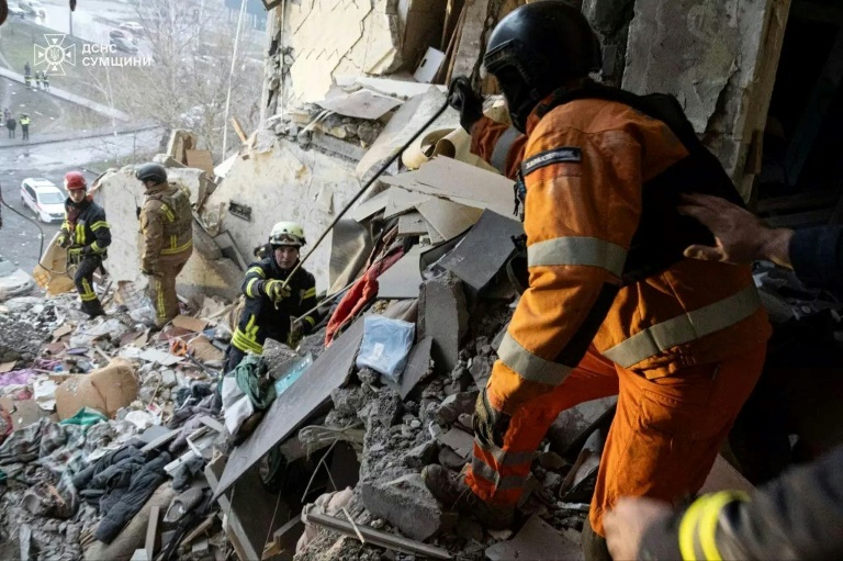 https://d.ibtimes.com/en/full/4579415/ukrainian-rescuers-cleaning-rubble-residential-building-following-overnight-drone-attack.jpg