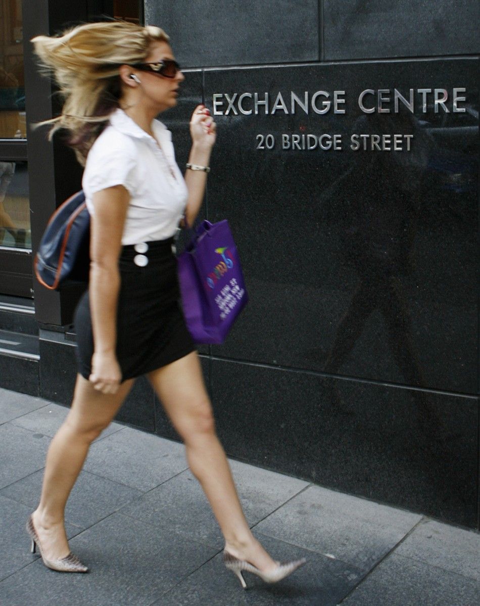 A woman walks past the Australian Securities Exchange ASX building in central Sydney