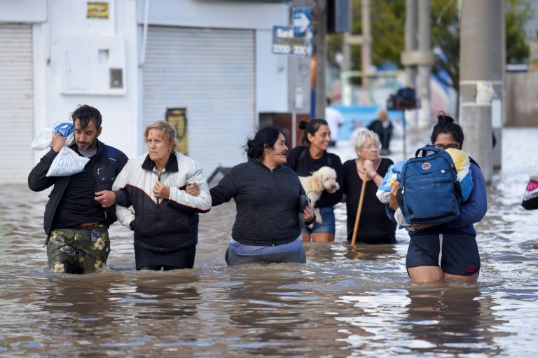 https://d.ibtimes.com/en/full/4585982/people-walk-through-flood-waters-bahia-blanca-argentina-march-8-2025.jpg