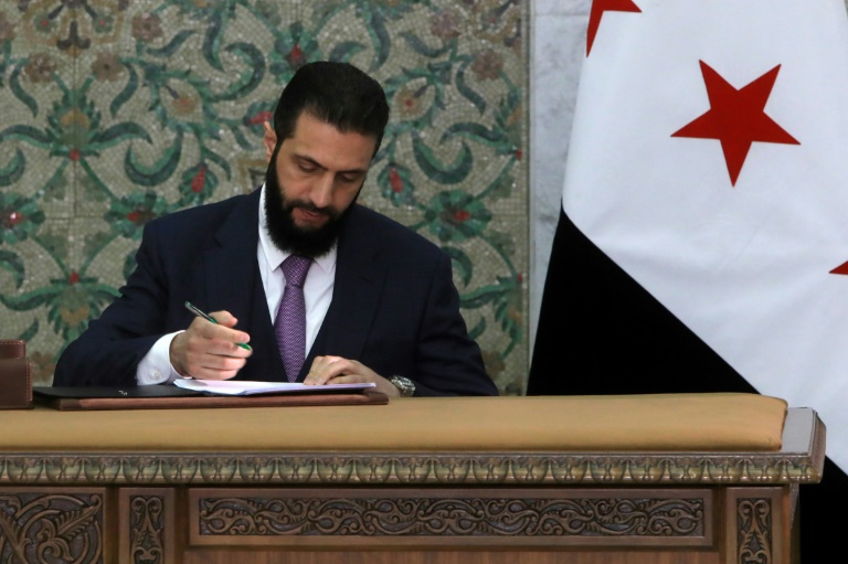 https://d.ibtimes.com/en/full/4586748/syrian-leader-ahmed-al-sharaa-signs-new-constitutional-declaration-which-will-regulate-countrys.jpg