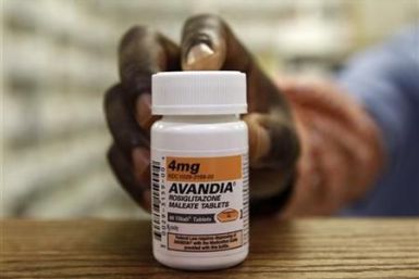 A pharmacist holds a bottle of Avandia in a store in Falls Church, Virginia