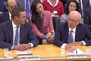 James and Rupert Murdoch appear before a parliamentary committee at Portcullis House in London