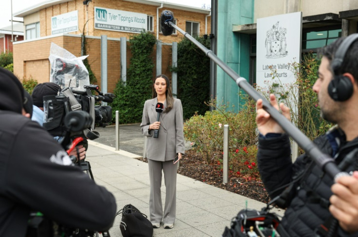 Journalists outside a court building in Morwell, where an Australian woman is being tried for the alleged murder of three people with a toxic mushroom-laced beef Wellington