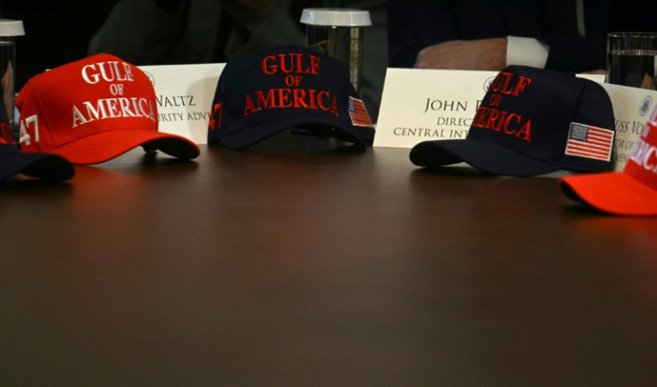 Gulf of America hats are set on a table as US President Donald Trump holds a meeting with his Cabinet on April 30, 2025