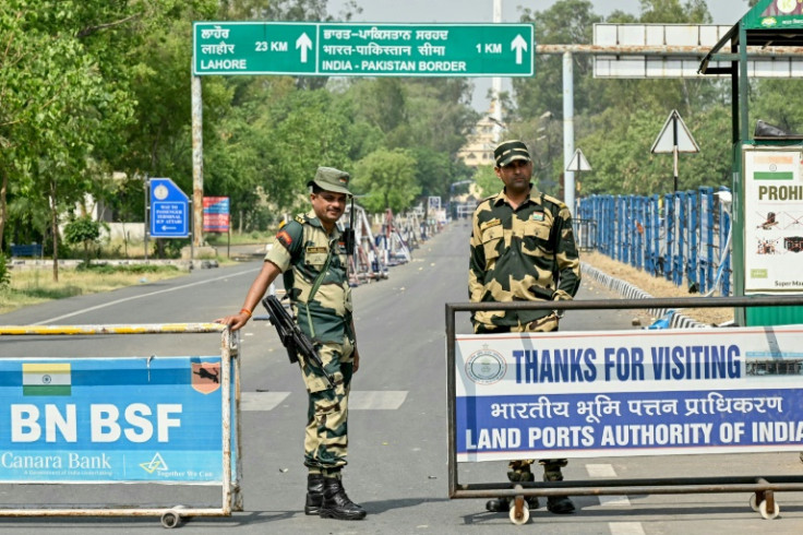 Indian Border Security Force personnel stand guard near the India-Pakistan Wagah border post