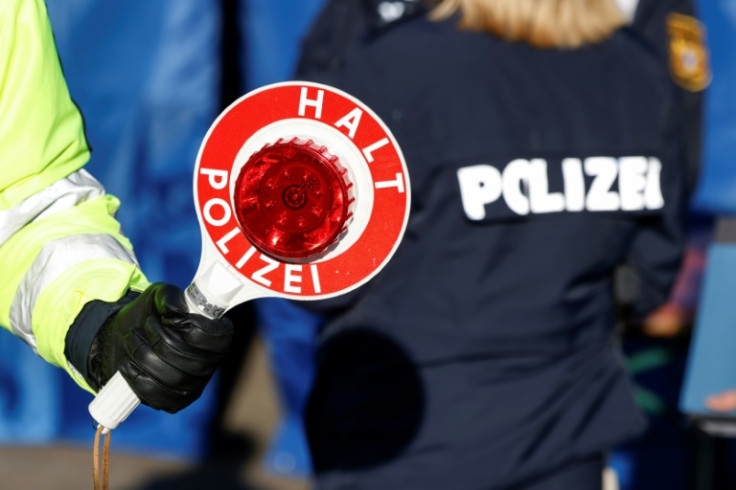 A German police officer at a border control station with Austria