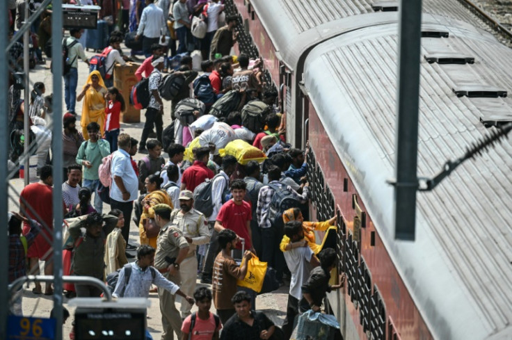 The panicked crowd scrambled to get on the train