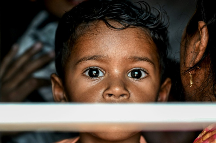 A boy looking out of the train