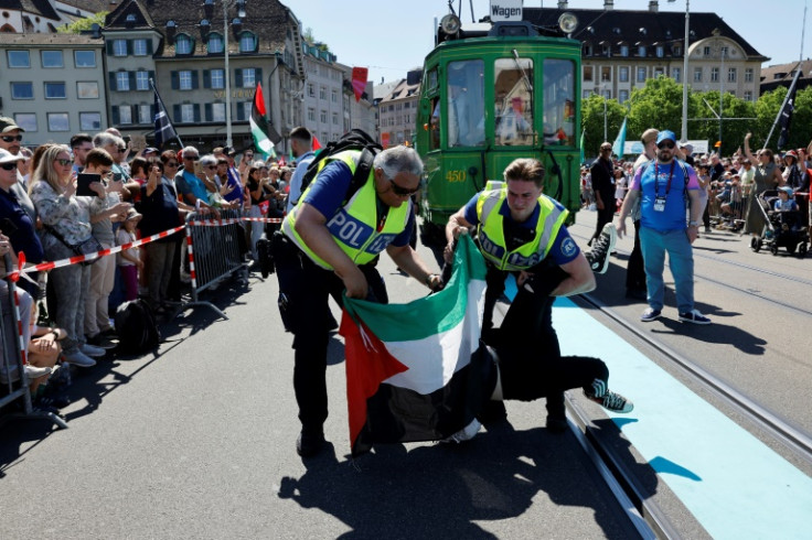 Police officers tackled a protester holding a Palestinian flag during the Eurovision Song Contest opening parade