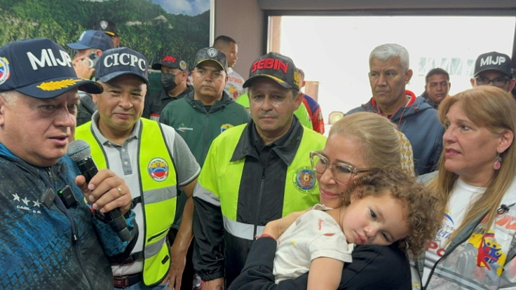 Venezuelan First lady Cilia Flores (R) welcomed home a toddler whose Venezuelan parents were deported from the United States without her