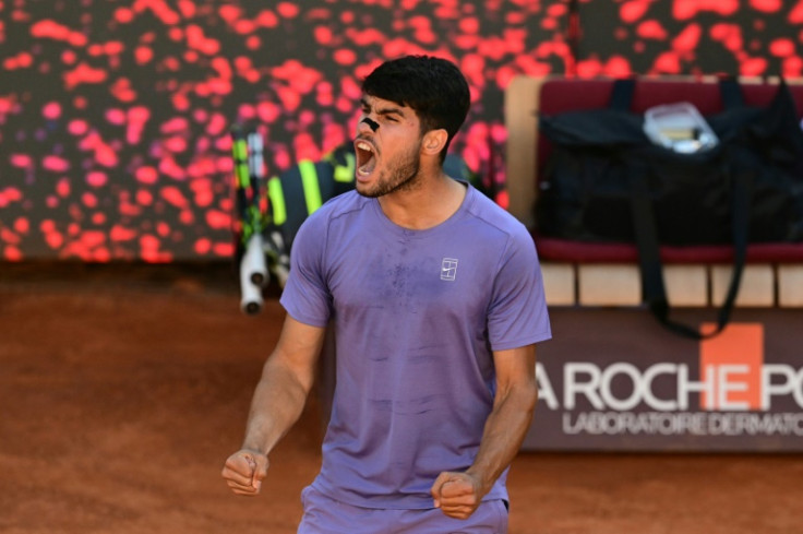 Carlos Alcaraz roars with delight after beating Lorenzo Musetti to reach the final
