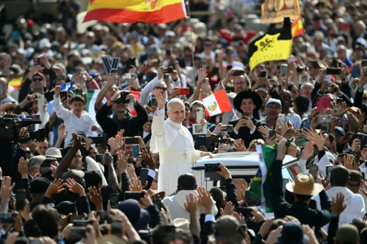 Pope Leo XIV greets the crowd from the popemobile before a Holy mass for the beginning of his pontificate