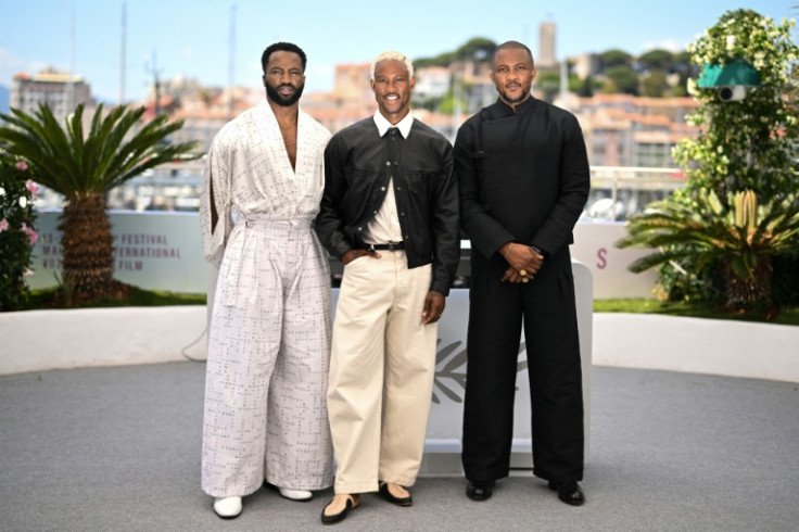 British-Nigerian actor Sope Dirisu, "My Father's Shadow" director Akinola Davies and his screenwriter brother Wale at Cannes