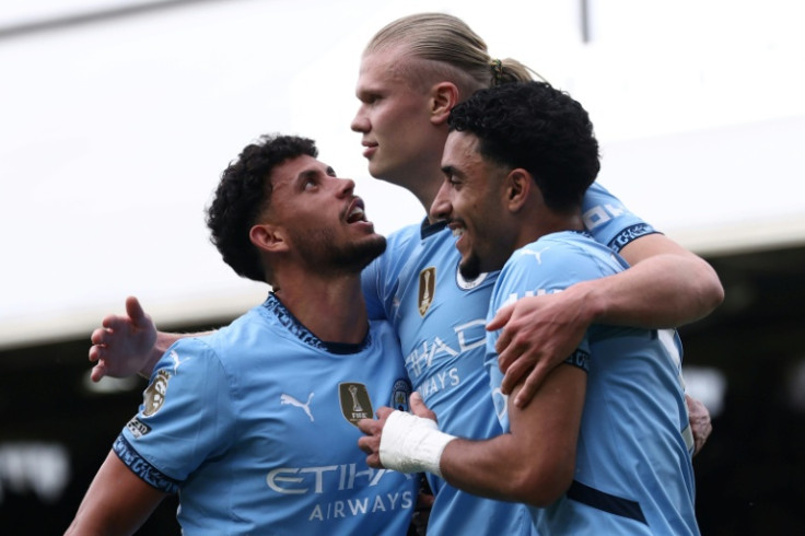Erling Haaland (centre) struck as Man City booked a place in the Champions League