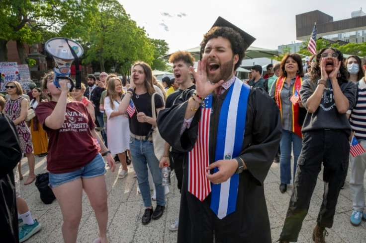 Graduating Harvard student Victor Flores and others rally in support of international students during a rally at the university's campus in Boston, Massachusetts