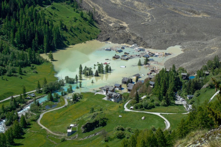 Swiss authorities say huge amounts of rock and ice from a glacier that collapsed in the Alps are hampering emergency services